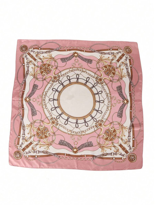 Primer plano del estampado de cadenas y flores en un pañuelo de satén rosa y blanco.