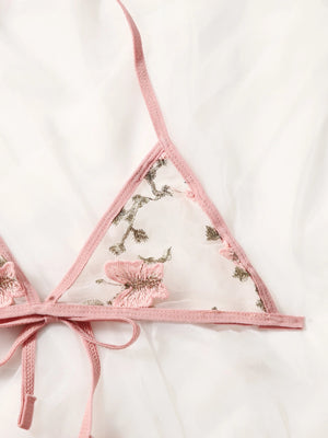 Conjunto de lencería rosa bordado transparente romántico detalle de bordado.