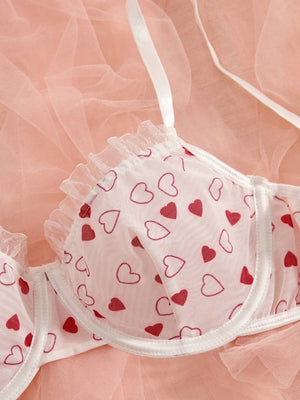 Conjunto Lencería Corazones Rojos transparente con aro detalle volante.