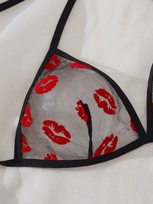 Conjunto de lencería negro transparente con estampado de labios romántico floral detalle de sujetador.
