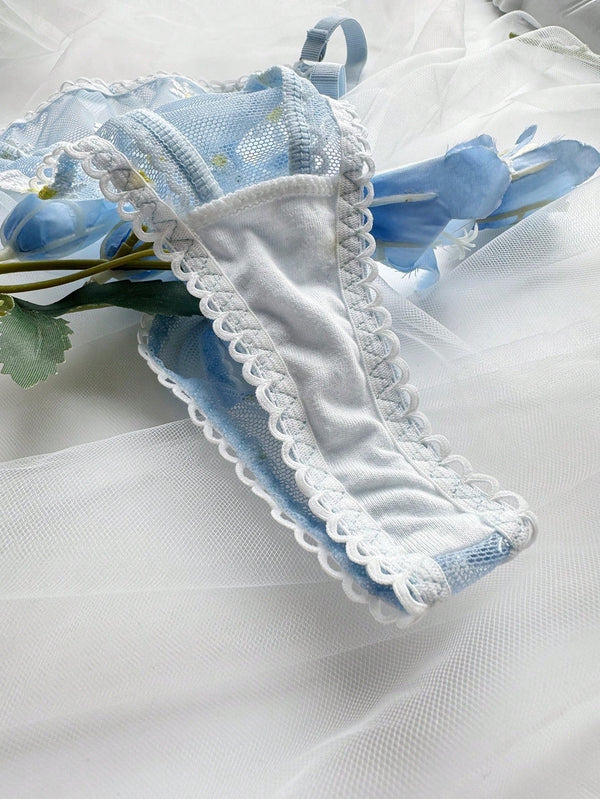 Braguita tipo calzoncillo con detalles bordados y lazo blanco.