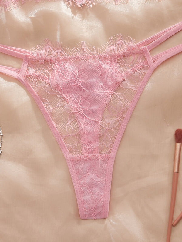 Presentación completa del conjunto de bustier con aro y tanga en tono rosa suave