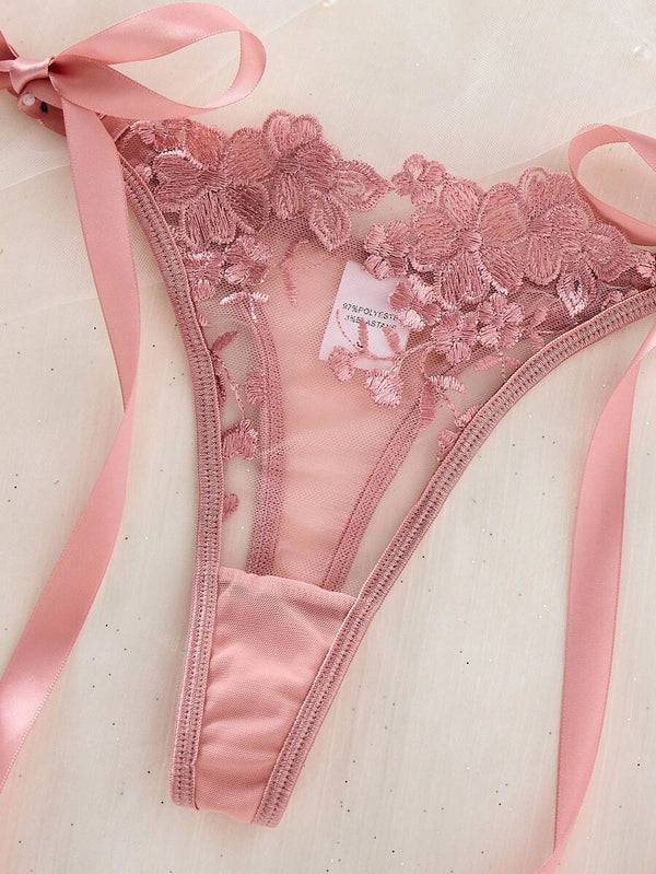 Conjunto íntimo de dos piezas color rosa viejo con detalles transparentes y moños