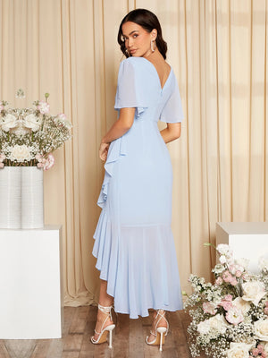 Vestido midi celeste con escote en V y volantes vista posterior.