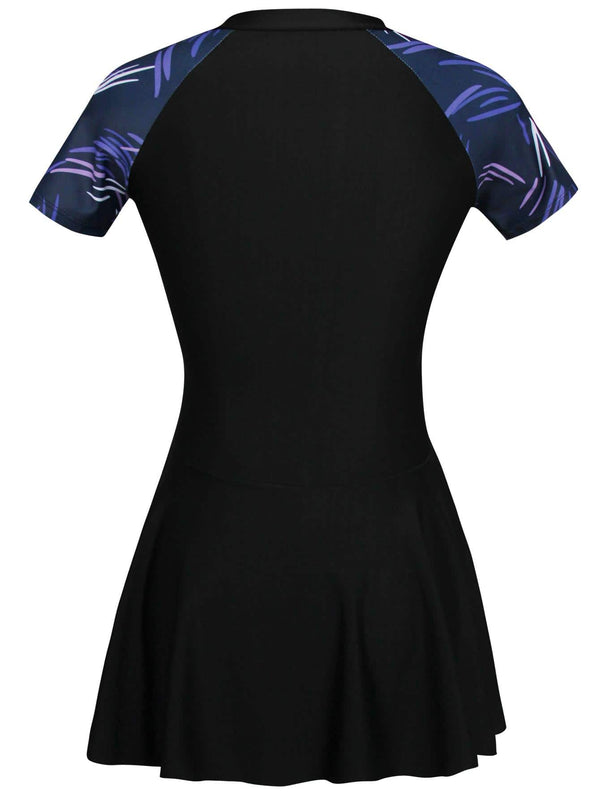 Detalle de cremallera en traje de baño tropical negro
