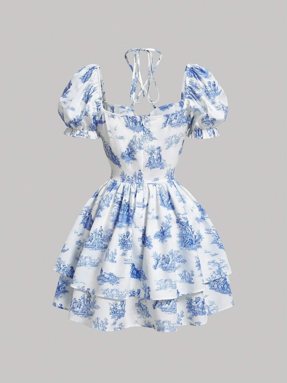 Imagen frontal del vestido corto azul y blanco con estampado, resaltando su diseño romántico.