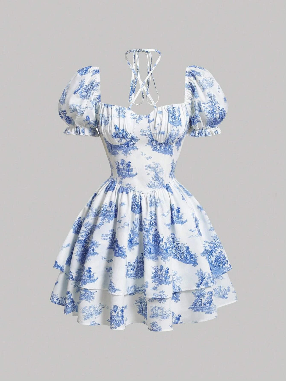Imagen frontal del vestido corto azul y blanco con estampado, resaltando su diseño romántico.