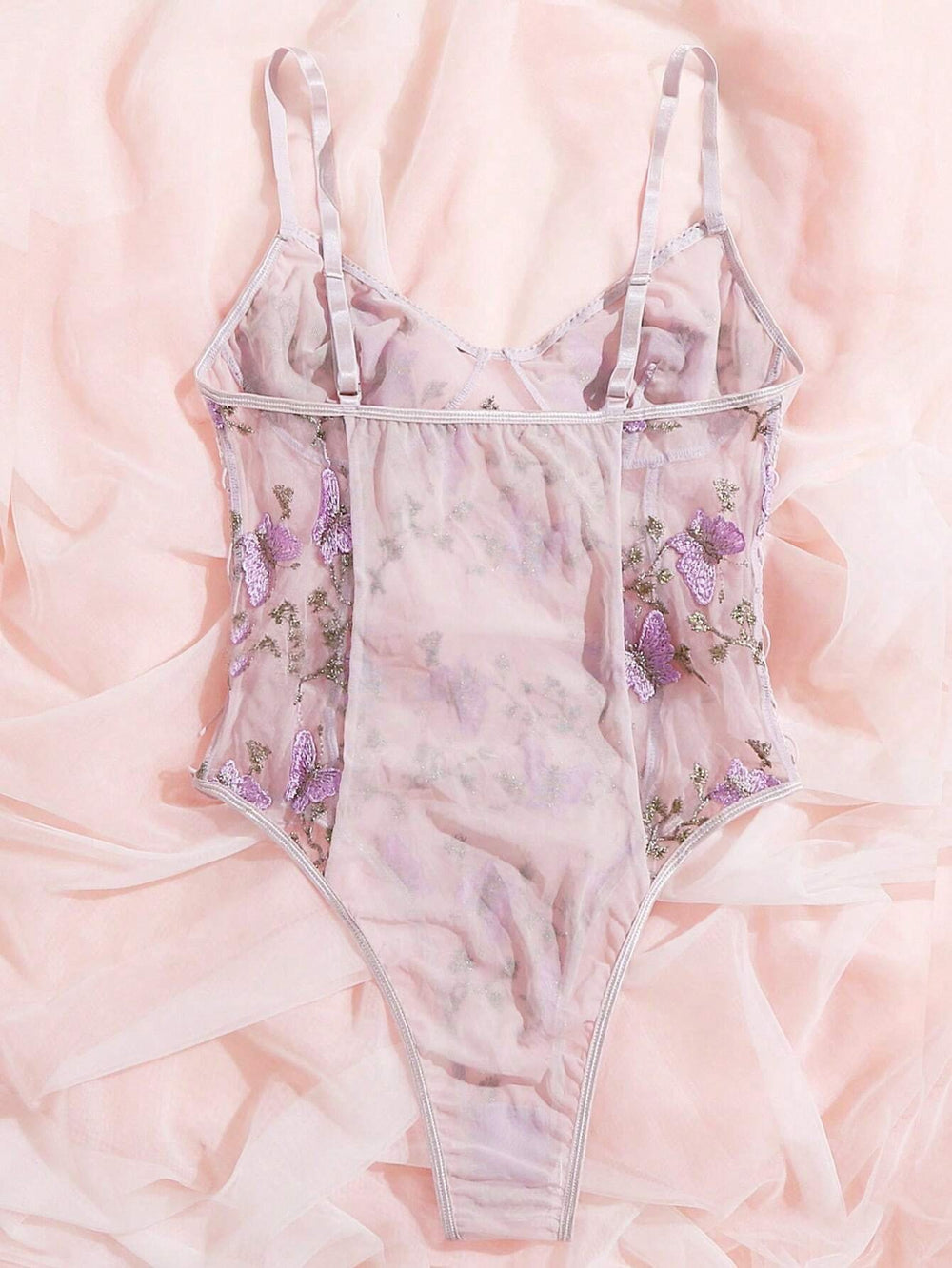 Body romántico floral en púrpura malva con bordado de mariposas.