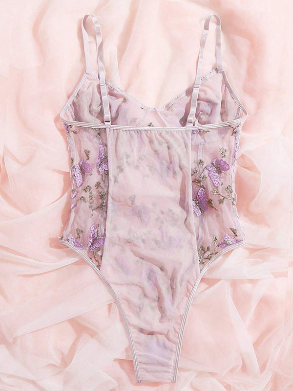 Vista trasera del body romántico floral con diseño semitransparente.