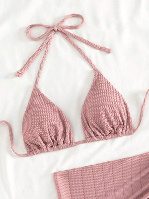 Bikini de 3 piezas rosa con top halter y pareo tejido texturizado