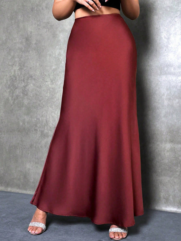 Detalle frontal de falda elegante roja maxi.
