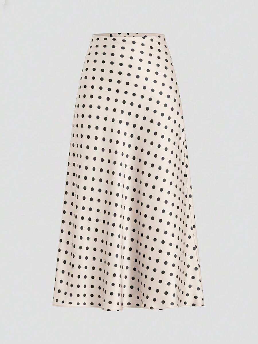Falda midi color beige con estampado de lunares negros vista frontal.