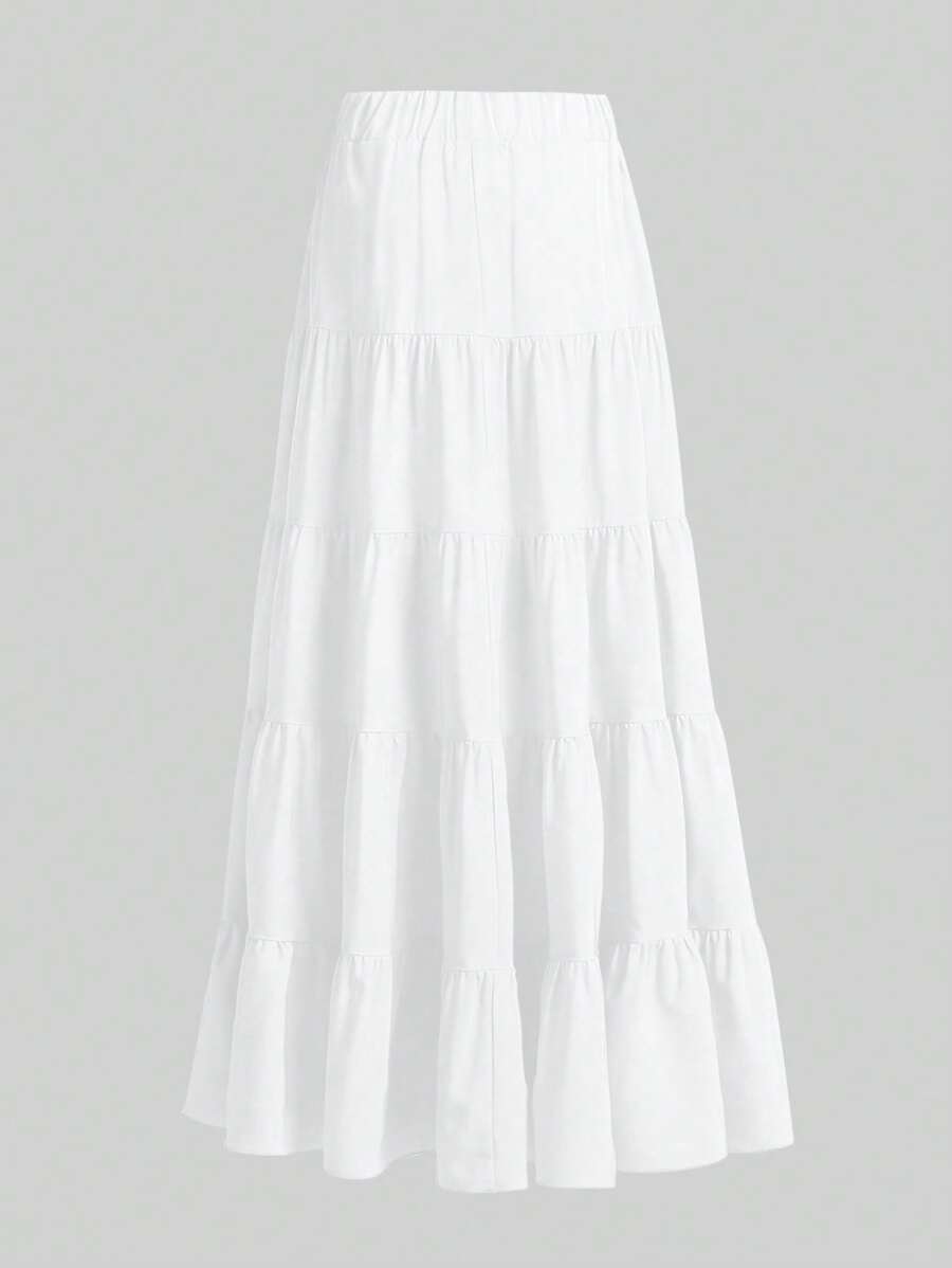 Falda larga blanca estilo bohemio con diseño de vuelos escalonados vista completa.