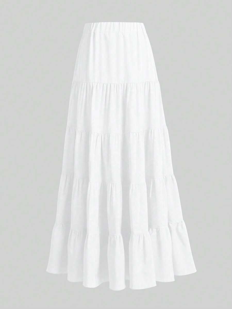 Falda larga blanca estilo bohemio con diseño de vuelos escalonados vista completa.