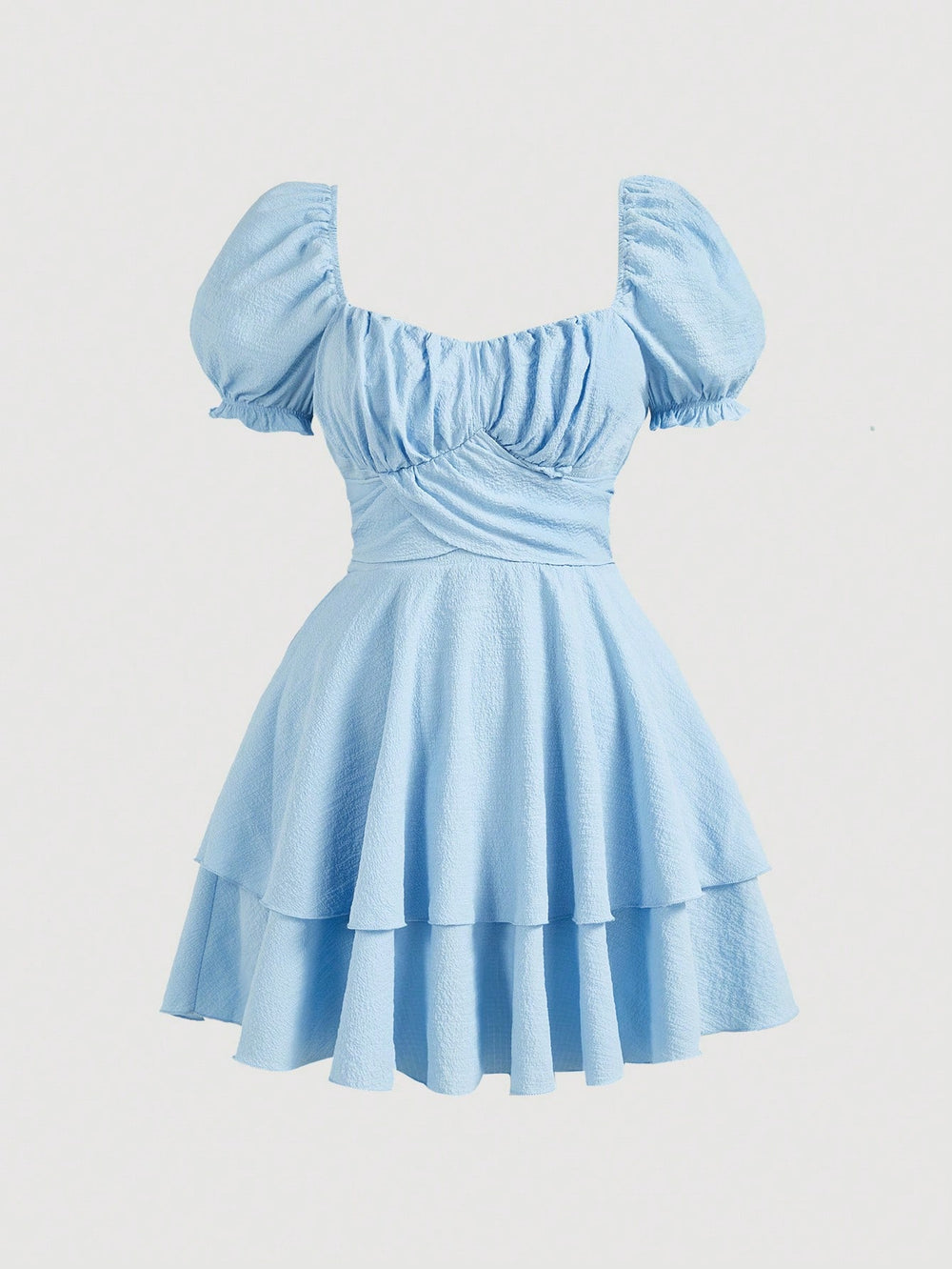 Vista frontal del vestido corto azul con mangas abullonadas de DAKARI.