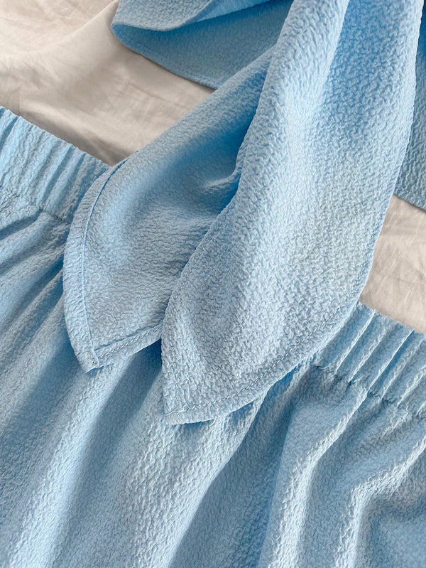 Conjunto Azul Bandeau Micro Y Falda Mini Bohemia Con Volante detalle volante.
