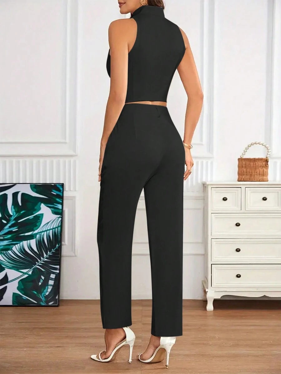Conjunto elegante negro con top crop y pantalón largo