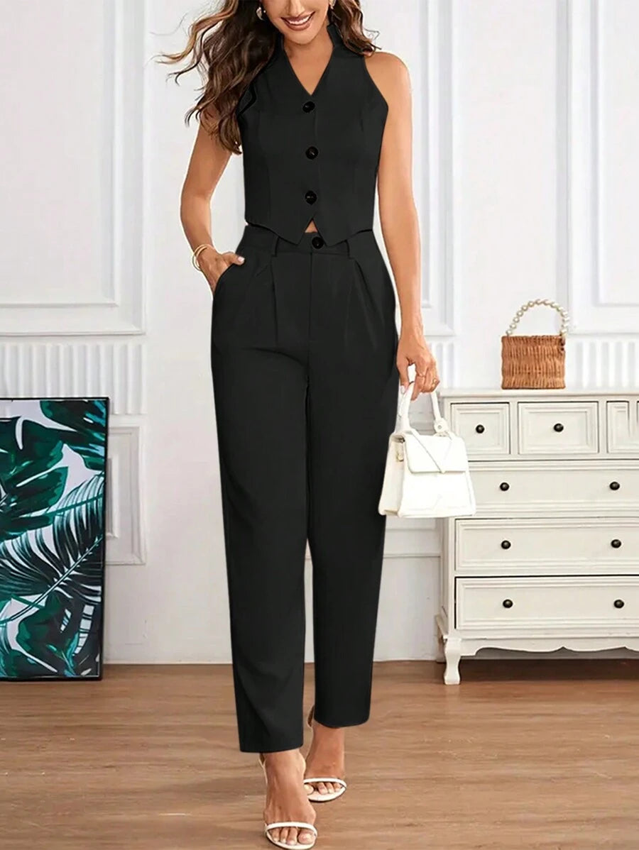 Conjunto elegante negro con top crop y pantalón largo