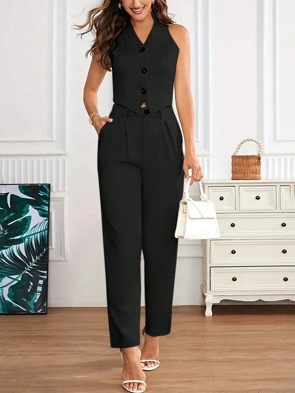 Conjunto elegante negro con top crop y pantalón largo