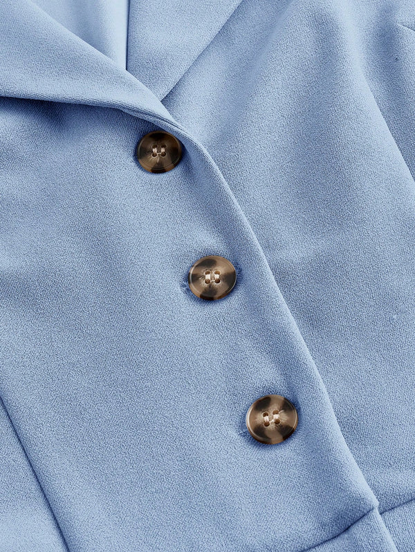 Detalle de botones del Mono Azul Elegante.