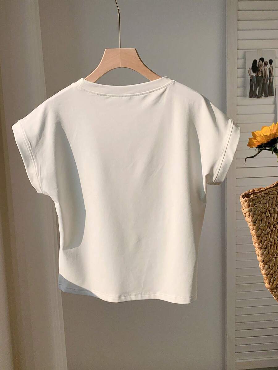 Blusa blanca casual con manga murciélago vista frontal