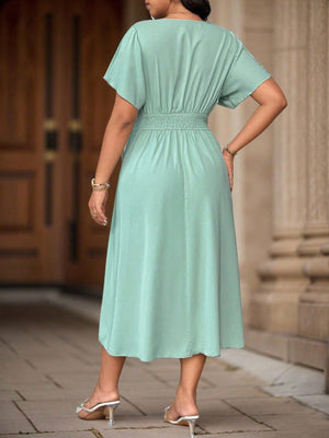 Vista trasera de vestido verde menta midi elegante