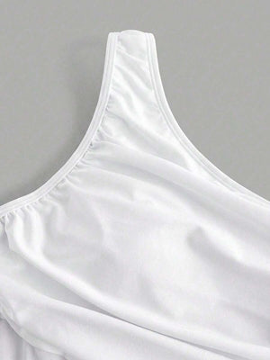 Detalle de la cintura con paneles transparentes y fruncidos del body de una pieza.