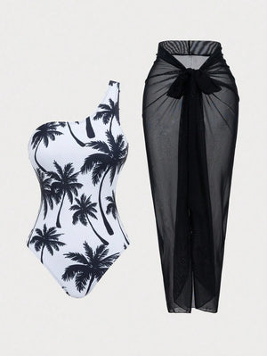 Detalle de la falda pareo larga y transparente en color negro, combinada con bolso de paja y sandalias blancas.