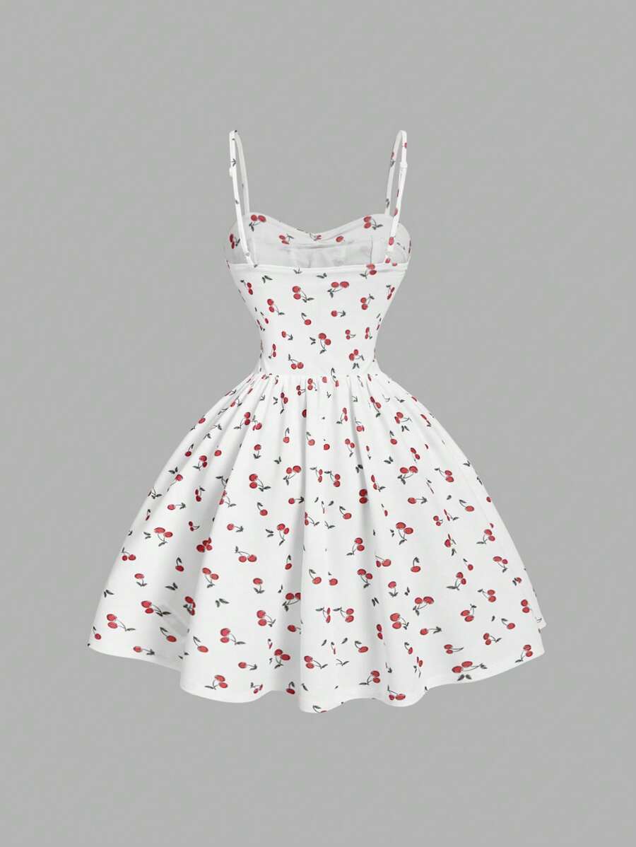 Vestido Blanco Corto Con Estampado De Cerezas y tirantes finos vista frontal.
