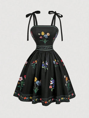 Vestido Corto Negro Bordado Floral Con Tirantes De Lazo vista frontal completa.
