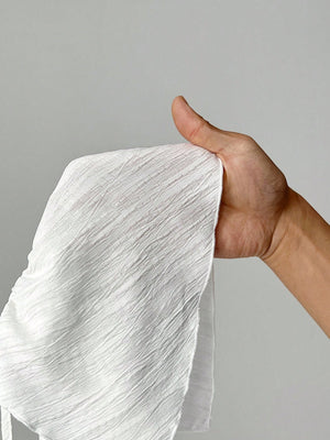 Textura de tela del conjunto halter blanco crop