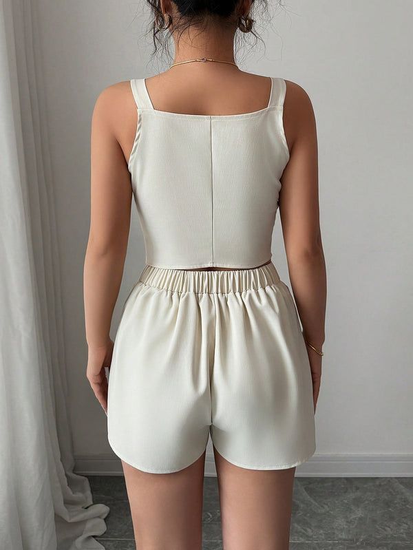 Conjunto albaricoque sastre con chaleco y short vista posterior.