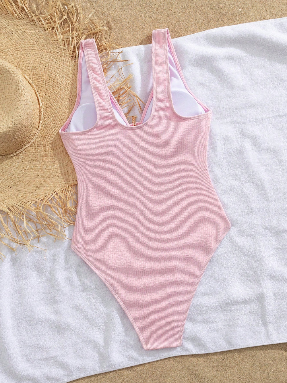 Traje De Baño Rosa Textura vista frontal con estrella de mar dorada.