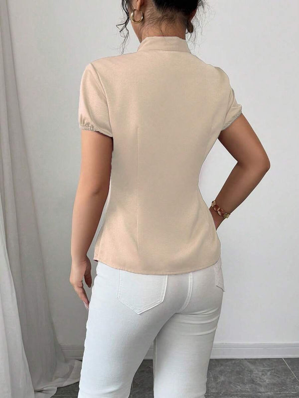 Camisa albaricoque con volantes y manga farol vista trasera.