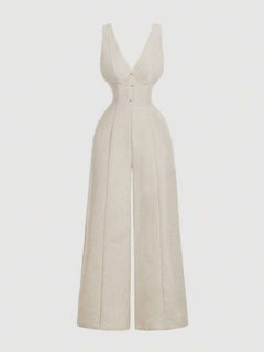 Jumpsuit elegante color beige de pierna ancha visto de frente.