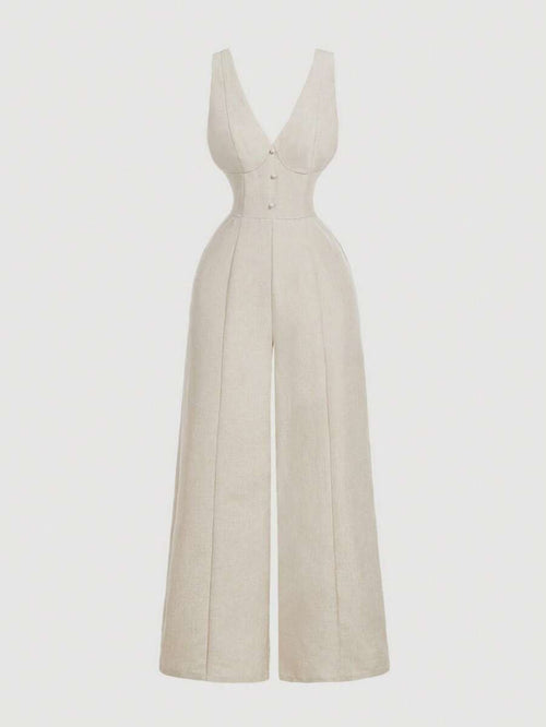 Jumpsuit elegante color beige de pierna ancha visto de frente.