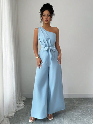 Enterizo azul asimétrico elegante con lazo y pierna ancha look completo