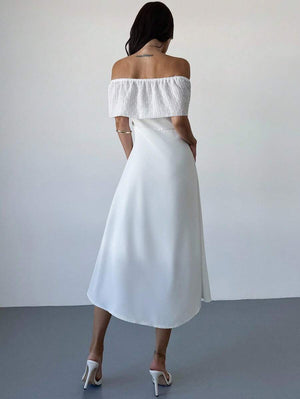 Vestido blanco elegante largo visto de espaldas.