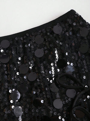 Falda elegante con lentejuelas textura y short interno.