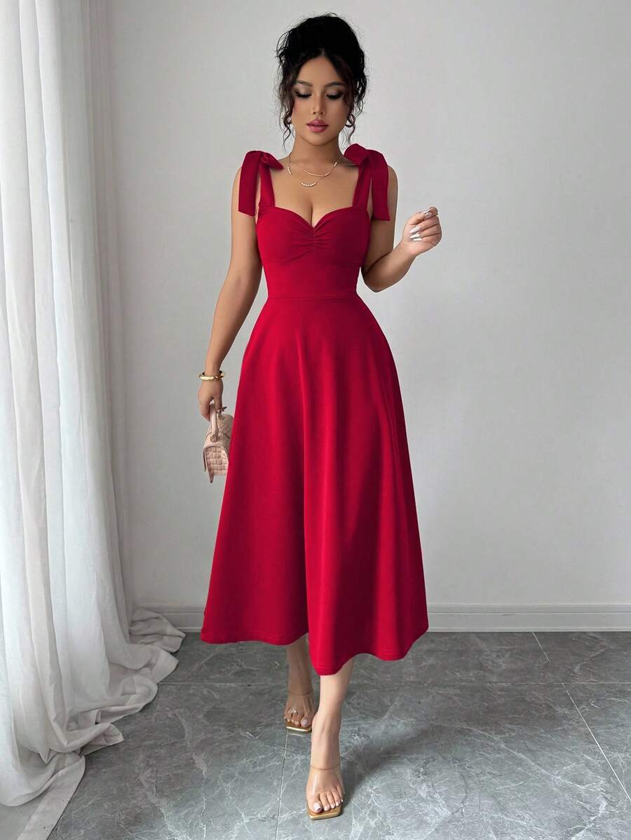 Vestido elegante rojo con tirantes y manga farol vista frontal