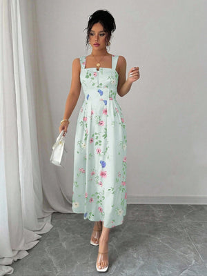 Vestido verde midi con tirantes y estampado floral detalle superior.