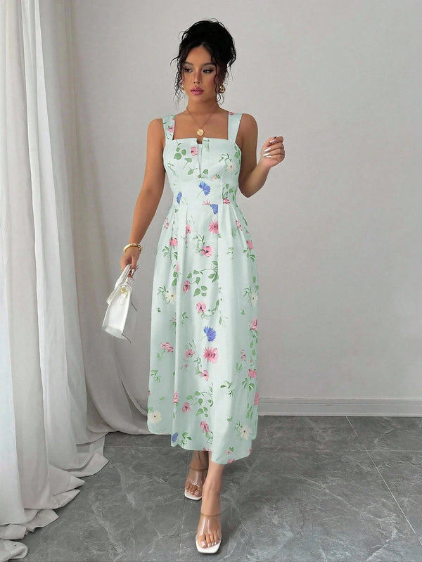 Vestido verde midi con tirantes y estampado floral detalle superior.