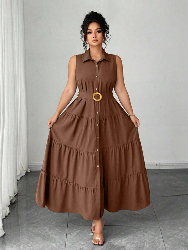 Detalle de la falda larga con volantes en capas de un vestido maxi color café.
