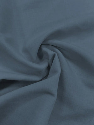 Vestido Azul Lavado Medio Midi Elegante Cruzado detalle de tela.