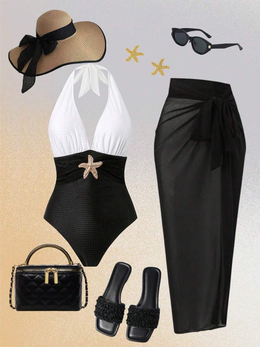 Conjunto de traje de baño de una pieza bicolor con pareo negro, sombrero de paja y sandalias.