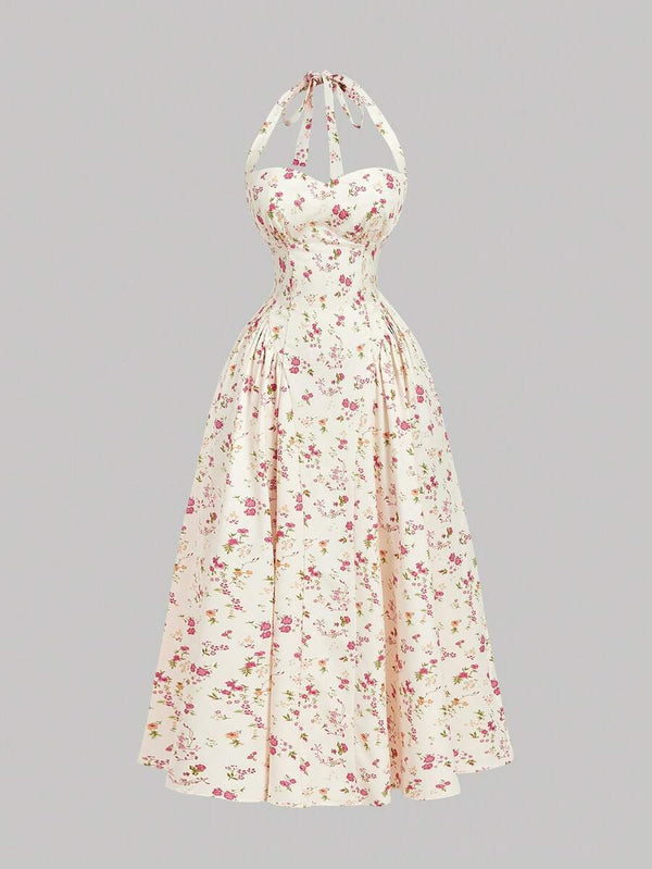 Detalle del corsé y escote corazón de un vestido floral blanco con flores rosas.