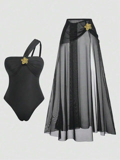 Conjunto completo de traje de baño asimétrico negro y falda larga de malla.