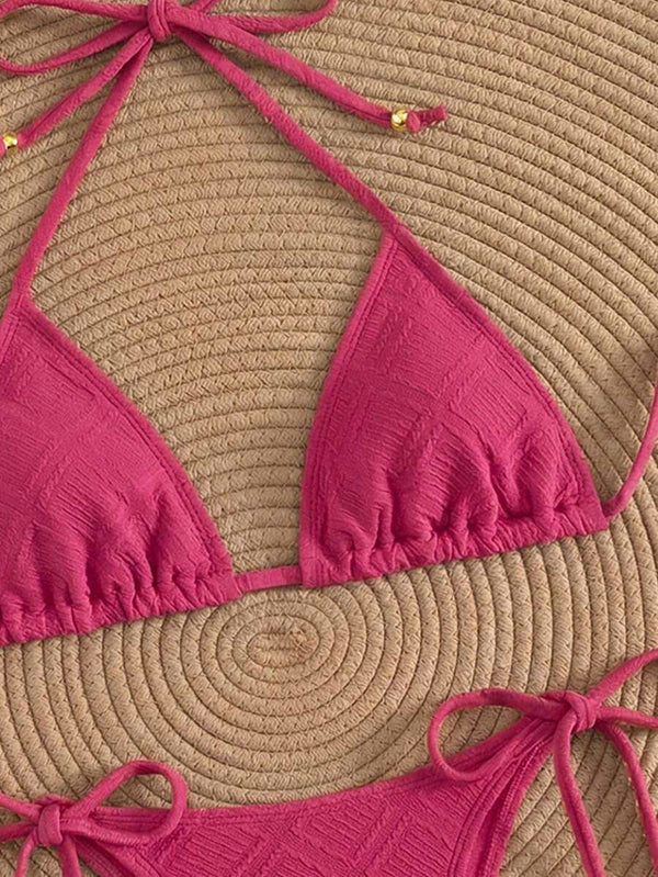 Braguita de bikini de talle alto color rosa fucsia con lazos laterales ajustables.
