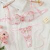 Set de lencería rosa con bordado floral y transparencias