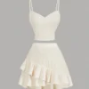 Conjunto crop albaricoque con top de tirantes y falda asimétrica - vista frontal.